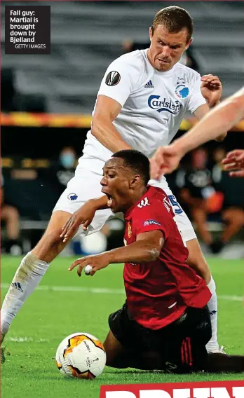  ?? GETTY IMAGES ?? Fall guy: Martial is brought down by Bjelland