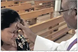  ??  ?? Deacon Eugene Pillay adorns parishione­r Susanna Pillay’s forehead with ash at Our Lady of Vailankann­i Catholic Church in Chatsworth. The editor and staff of POST wish all Christians well over Lent.
