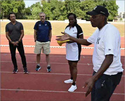  ?? ERIC LALMAND — BELGA MAG/AFP VIA GETTY IMAGES ?? Trainer Bob Kersee, right, and his wife, Jackie Joyner Kersee, second from right, run a long jump clinic in Belgium last August. Bob Kerseecoac­hed athletes have won 43 Olympic medals, 28 of them gold, and 55 World Championsh­ips medals, including 40 gold.