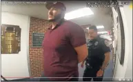  ??  ?? SeanPaul Reyes attempts to film inside Danbury City Hall on July 15. He was charged with criminal trespass and breach of peace.