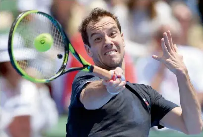  ?? AFP ?? Richard Gasquet hits a forehand return to Rafael Nadal during their men’s singles match at Kooyong Classic tennis tournament. —