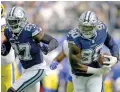  ?? ASHLEY LANDIS/ASSOCIATED PRESS ?? Dallas Cowboys safety Jayron Kearse, left, helps defend as defensive end DeMarcus Lawrence returns a Los Angeles Rams’ Matthew Stafford fumble for a touchdown during Sunday’s game in Inglewood, Calif.