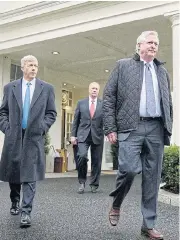  ?? /Bloomberg ?? Security goal: CEOs of Exelon Chris Crane, right, Centrus Energy Dan Poneman, left, and NuScale Power John Hopkins arrive to speak to the media outside the White House in Washington after a meeting with US President Donald Trump on Tuesday.