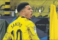  ?? AFP ?? Jadon Sancho celebrates scoring Borussia Dortmund’s opener during Wednesday’s Champions League win over PSV Eindhoven.