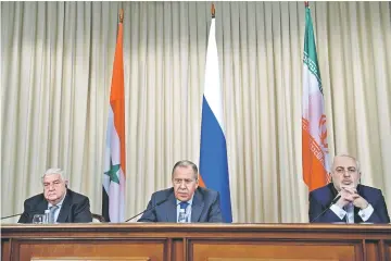  ??  ?? Lavrov (centre), his Iranian counterpar­t Mohammad Javad Zarif (right) and Syrian Foreign Minister Walid Muallem hold a joint press conference after their talks in Moscow.