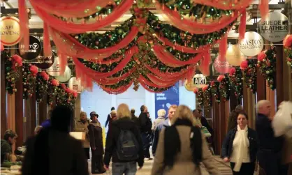  ??  ?? Christmas shoppers in Manchester. Photograph: Christophe­r Furlong/Getty Images