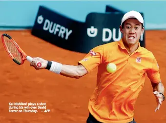  ?? AFP ?? Kei Nishikori plays a shot during his win over David Ferrer on Thursday.