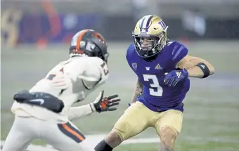  ?? Ted S. Warren, The Associated Press ?? Washington cornerback Elijah Molden (3) produced four intercepti­ons, 17 passes defended and three forced fumbles in 2019.