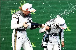  ?? PICTURE: Bryn Lennon/getty Images ?? Jamie Chadwick (right) celebrates her win in Hungary with Alice Powell