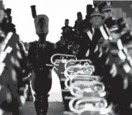  ?? JOSHUA A. BICKEL/COLUMBUS DISPATCH ?? Drum major Austin Bowman waits to run down the ramp for his entrance before the Ohio State-university of Akron game Sept. 25. Ascending to the rank of drum major has been a dream for the 19-year-old Hebron native since eighth grade.