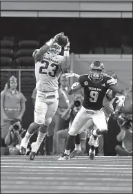  ?? NWA Democrat-Gazette/J.T. WAMPLER ?? Arkansas’ Dre Greenlaw intercepts a pass intended for Texas A&amp;M’s Hezekiah Jones on Saturday at AT&amp;T Stadium in Arlington. The Aggies beat the Razorbacks 24-17.