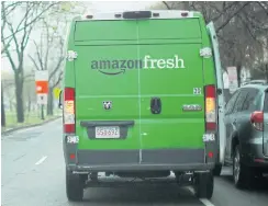  ?? REUTERS ?? An Amazon Fresh truck makes a delivery in Cambridge, Massachuse­tts in this file photo.