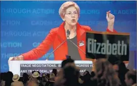  ?? Irfan Khan Los Angeles Times ?? SEN. ELIZABETH WARREN (D-Mass.) drew cheers when she said President Obama’s planned Pacific trade pact would “leave American workers in the dirt.”