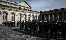  ??  ?? Police in Bordeaux observed a minute’s silence on Monday for Samuel Paty. Photograph: Philippe Lopez/AFP/Getty Images