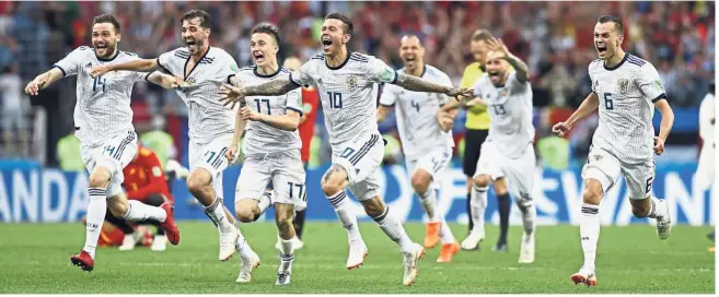  ?? — AP ?? Amazing feat: Russia players celebratin­g after beating Spain in a penalty shootout during the last-16 match at the Luzhniki Stadium in Moscow yesterday.