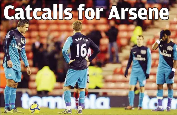  ??  ?? Gunned down: (From left) Arsenal’s Robin van Persie, Aaron Ramsey, Sebastien Squillaci and Alex Song react after going a goal down to Sunderland during their FA Cup fifth round match on Saturday. Sunderland won 2-0.