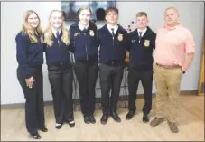  ?? Westside Eagle Observer/SUSAN HOLLAND ?? Members of the Gravette Future Farmers of America chapter and their sponsor, agricultur­e teacher Justin Malott (right), pose after making a presentati­on at the Sept. 19 meeting of the Gravette School Board. Board members approved the students’ request to attend the national FFA convention in Louisville, Ky. Students pictured are Autumn Fisher, Kassi Bird, Ashlyn Fox, Clayton Nall and Jake Mayor.