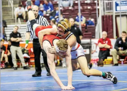  ?? NATE HECKENBERG­ER - FOR DIGITAL FIRST MEDIA ?? Boyertown’s Hunter Vogels takes down Clearfield’s Zane Morgan en route to a second-period pin at 152pounds.