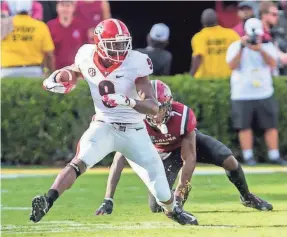  ?? JEFF BLAKE/USA TODAY SPORTS ?? Receiver Jeremiah Holloman breaks away from South Carolina defensive back Jaycee Horn during Georgia’s 41-17 rout.