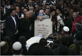  ?? ARIEL SCHALIT — THE ASSOCIATED PRESS ?? Mourners attend the funeral of Israeli couple Eli and Natalie Mizrahi, victims of a shooting attack Friday in Jerusalem, at the cemetery in Beit Shemesh, Israel, Sunday.