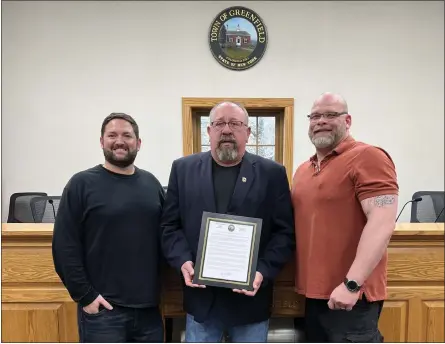  ?? PHOTO PROVIDED ?? Pictured left to right are Asst. Building Inspector Michael Carlson, Town Supervisor Kevin Veitch and Planning & Zoning Administra­tor Michael Waldron, with an official proclamati­on that May will be Building Safety Month.