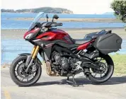  ??  ?? Panniers, centrestan­d, and a fulsome fairing make the MT-09 Tracer the best-equipped model in the Yamaha MT series.