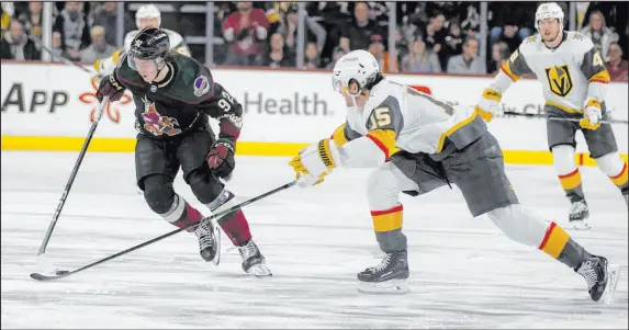  ?? Darryl Webb The Associated Press ?? Noah Hanifin, trying to poke-check Coyotes center Logan Cooley on Friday, arguably has been the Knights’ best defenseman of late.