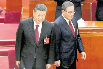  ?? AP ?? Chinese President Xi Jinping, left, and Chinese Premier Li Qiang arrive for the opening session of the National People’s Congress in Beijing, China, on Tuesday, March 5, 2024.
