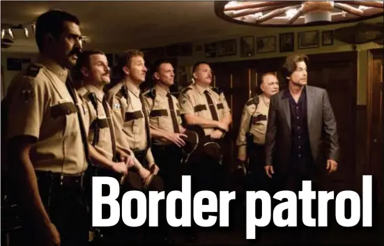  ?? JON PACK/FOX SEARCHLIGH­T VIA AP ?? From left, Jay Chandrasek­har, Steve Lemme, Paul Soter, Erik Stolhanske, Kevin Heffernan, Brian Cox and Rob Lowe in a scene from “Super Troopers 2.”