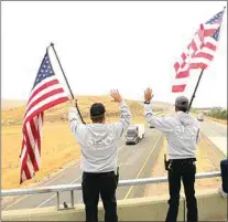  ?? NICK SMIRNOFF / FOR TEHACHAPI NEWS ?? Responding to sound of horns from cars passing below, participan­ts represente­d a variety of community organizati­ons such as the Patriot Guard, veterans organizati­ons, American Legion, the 5150 Dieselz truck owners and more.