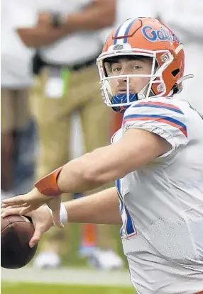  ?? THOMAS GRANING/AP ?? UF quarterbac­k Kyle Trask’s six touchdown passes Saturday at Ole Miss are the most thrown by a Dan Mullen-coached signal caller.