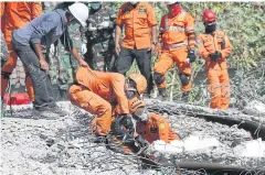  ?? AP ?? Rescuers are still struggling to reach all of the affected areas and authoritie­s expect the death toll to rise.