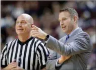  ?? THE ASSOCIATED PRESS ?? In this file photo, Buffalo head coach Nate Oats talks with a referee during the first half of a game against Texas A&M, in College Station, Texas. Nate Oats was credited for doing a remarkable job in leading the University at Buffalo to an NCAA...