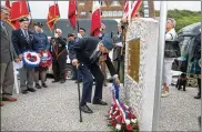  ?? GETTY IMAGES ?? Lesley George Robinson, 98, who landed at Omaha Beach, lays a wreath while attending a ceremony at Vierville-sur-Mer in Normandy on Monday near Bayeux, France.