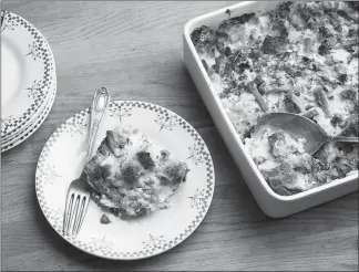  ?? PHOTOS BY KARSTEN MORAN / THE NEW YORK TIMES ?? This savory bread pudding is ready for serving. The “custard” in this breakfast pudding has no sugar, just a dash of black pepper, a pinch of cayenne, half-and-half and a few eggs.