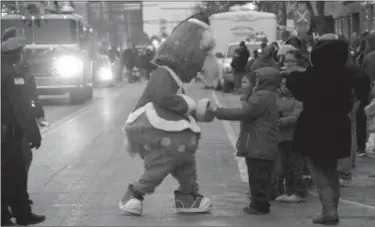  ?? Drew Scofield/dscofield@morningjou­rnal com ?? Cleveland Indians mascot Slider made an appearance during Light Up Lorain as part of the parade that traveled through downtown.