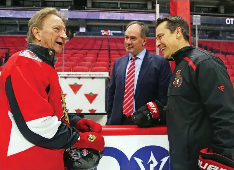  ?? JEAN LEVAC FILES ?? From left, Senators owner Eugene Melnyk, GM Pierre Dorion and head coach Guy Boucher in happier times — just over three months ago. Melnyk recently saw his plans for a new downtown arena fall flat and on Friday the Sens fired Boucher, just a day after Dorion said his job was safe.