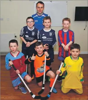  ??  ?? Photo: Kevin McGlynn. Shinty developmen­t officer Euan McMurdo pictured with team representa­tives Calum Campbell of Rockfield, James Muir of Rockfield, Euan Tosh of Park; front row: Sam Anderson of Dunadd, Scott McPhee of Taynuilt and Conon Burn of St...