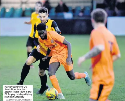  ?? ALISTAIR WILSON, AN200903 ?? Hartley Wintney FC’s Annis Nuur in action against Poole Town in the FA Trophy third qualifying round on Saturday