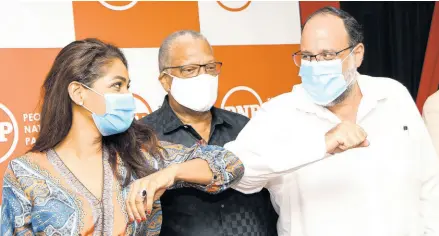  ??  ?? RUDOLPH BROWN/
PHOTOGRAPH­ER Lisa Hanna (left) and Mark Golding, People’s National Party (PNP) Presidenti­al candidates, greet each other after signing the PNP internal presidenti­al election code of conduct as Dr Peter Phillips (centre), the current president of PNP, looks on.