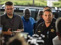  ?? LAURA HEALD / ASSOCIATED PRESS ?? Jacksonvil­le Sheriff Mike Williams (right) speaks to reporters Sunday after a gunman opened fire during a video-game tournament at the Jacksonvil­le Landing waterfront mall.