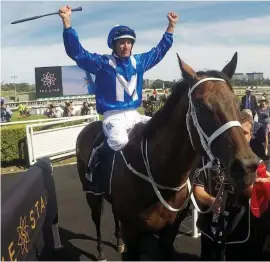  ??  ?? VICTORY SALUTE. Hugh Bowman celebrates after Winx wins her 30th successive race, the Group 2 The Star Apollo Stakes at Randwick.