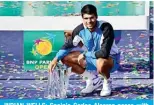  ?? — AFP photos ?? INDIAN WELLS: Spain’s Carlos Alcaraz poses with the championsh­ip trophy after defeating Russia’s Daniil Medvedev in the ATP-WTA Indian Wells MasTennis Garden in Indian Wells.