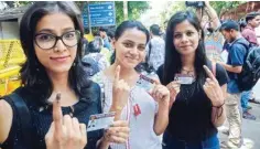  ?? PIC/ NAVEEN SHARMA ?? Delhi University students showing inked mark after casting their votes for the DUSU election, at their college in North Campus in New Delhi on Wednesday