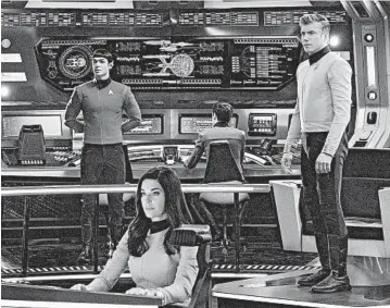  ?? MICHAEL GIBSON/CBS ?? Ethan Peck as Spock, from left, Rebecca Romijn as Number One, and Anson Mount as Captain Pike will star in the new series “Star Trek: Strange New Worlds,” set in the decade before Captain Kirk takes command of the starship Enterprise.