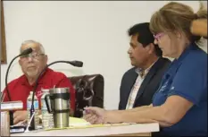  ?? WILLIAM ROLLER PHOTO ?? FROM LEFT: Medina Spellins, City Manager Rom Medina and City Clerk Catherine Hoff amend the city budget to include state grants recently received for capital improvemen­t projects at Calipatria's city council meeting on Tuesday.