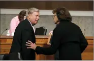  ?? CAROLYN KASTER — THE ASSOCIATED PRESS ?? Chairman Lindsey Graham, R-S.C., talks with Sen. Dianne Feinstein, D-Calif., after a Senate Judiciary Committee business meeting to consider authorizat­ion for subpoenas relating to the Crossfire Hurricane investigat­ion and other matters on Capitol Hill on Thursday.