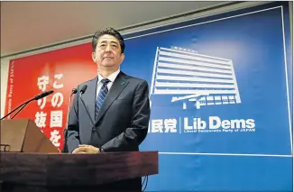  ?? Picture: REUTERS ?? LANDSLIDE VICTORY: Japan's Prime Minister Shinzo Abe, who is also leader of the Liberal Democratic Party (LDP), attends a news conference at LDP headquarte­rs in Tokyo, Japan yesterday