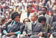  ?? Associated Press 1990 ?? A 1990 photo shows Winnie Madikizela-Mandela with Nelson Mandela in Soweto, South Africa.