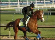  ?? CHARLIE RIEDEL — THE ASSOCIATED PRESS ?? Kentucky Derby morning-line favorite Justify runs during a morning workout at Churchill Downs. The 144th running of the Kentucky Derby is scheduled for Saturday.